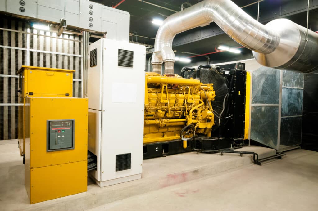 Pumping station and electrical power generator: industrial interior with pipe lines in a large building. Generator Repair by Mister Sparky of Charleston, SC