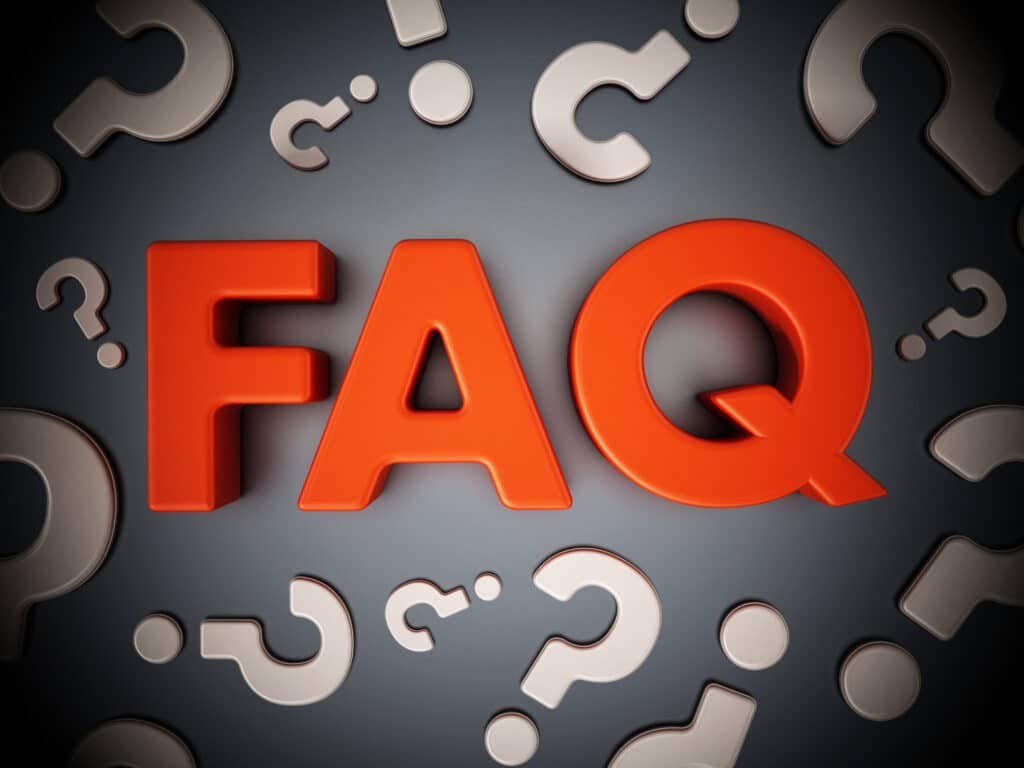 FAQ (Frequently Asked Questions) word and question mark signs standing on a black surface. FAQs about Generator Repair by Mister Sparky of Charleston, SC