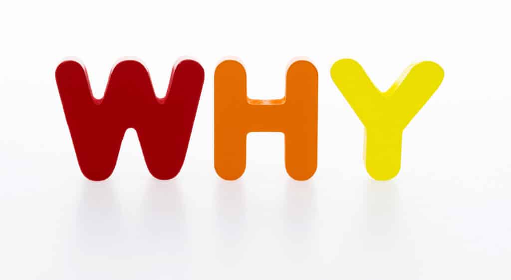 A captivating image featuring the wooden word "WHY" against a pristine white background sets the stage for a compelling question: "Why Invest in Generator Installation?"