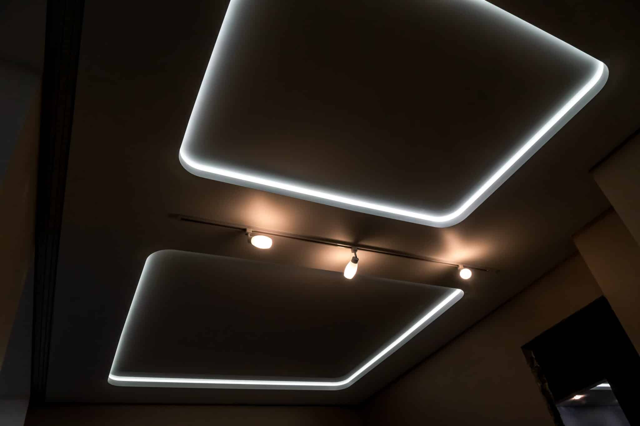 Beautiful stretch ceiling with dimmable LED lighting, featuring two squares and lights.