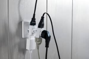 Multiple plugs in a wall electrical outlet can cause dangerous electrical overloads.