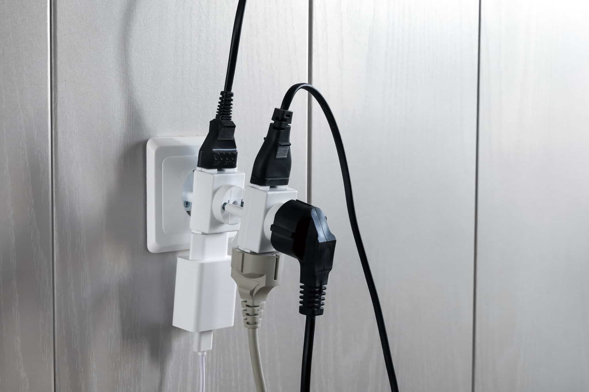 Multiple plugs in a wall electrical outlet can cause dangerous electrical overloads.